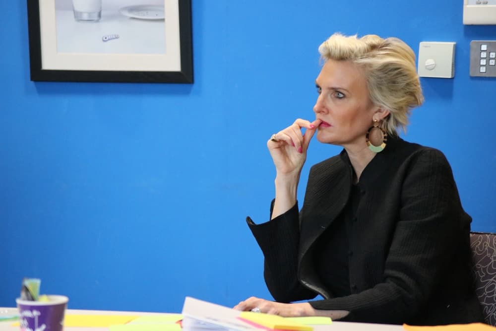 Professional lady listening at conference