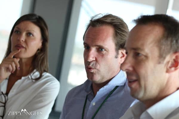 3 professional people at a Heineken corporate conference in Madrid